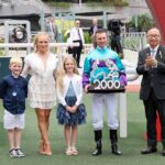 Zac Purton and family celebrate 2000 winners