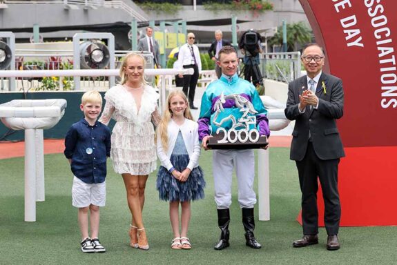 Zac Purton and family celebrate 2000 winners