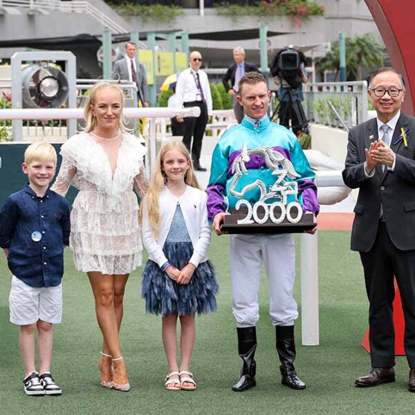 Zac Purton and family celebrate 2000 winners