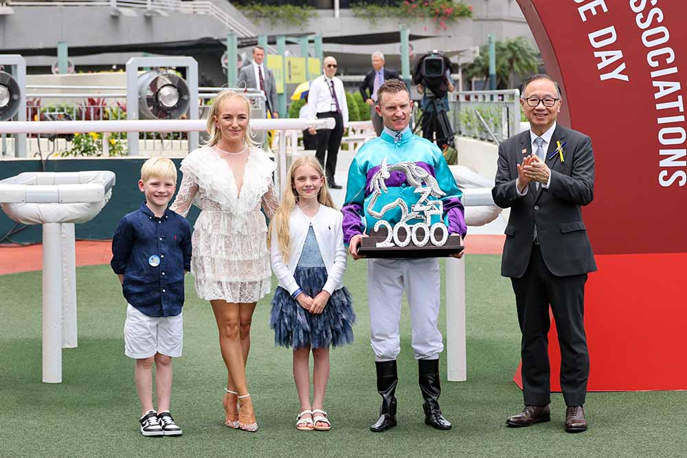 Zac Purton and family celebrate 2000 winners